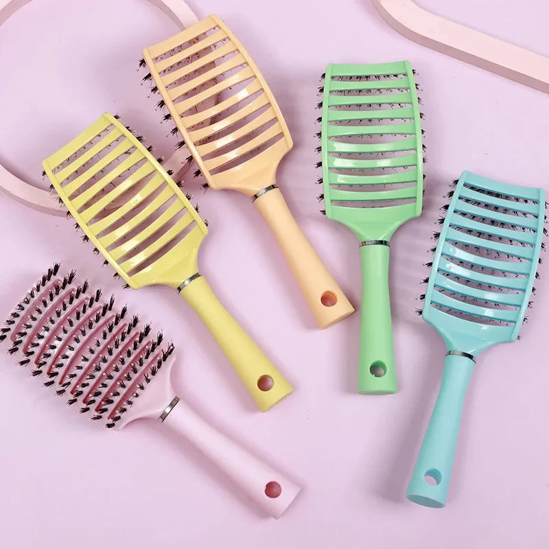 Image of 5 Detangle Bliss Brushes displayed with a light pink background